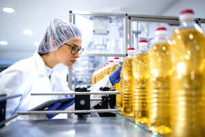 Food factory inspector doing visual inspection of the product.